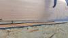 Right - Mastic is being installed to air seal the wood-to-wood joints in this wall.