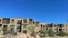 Wrong – This multi family building appears to be done in traditional southwest architecture but the lack of useful overhangs, dark colored walls, and lack of tinting on windows will result in significant solar heat gain.