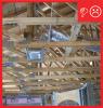 Wrong: Ducts are held above the ceiling plane with strapping to provide a good angle into top-entry boots. Once the ceiling insulation is added, this duct will protrude from the ceiling insulation and will not be buried