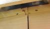 Wrong: The fiber-cement siding has cracked due to over-driven nails located too close to the edge of the board; these cracks provide a pathway for bulk water entry and offer little resistance to high winds.