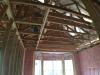 The OSB roof decking product comes with an adhered radiant foil barrier which helps to prevent heat transfer in or out of the vented attic, while R-13 unfaced fiberglass fills the advanced-framed 2x6 walls.