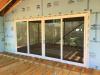 The exterior of the home is wrapped in a continuous layer of rigid foam with all seams taped to provide a thermal, air, and moisture barrier and serve as a drainage plane, eliminating the need for house wrap.