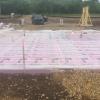 The home’s slab-on-grade foundation is wrapped in a blanket of rigid foam extending completely under the slab and along the edges.