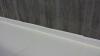Four inches of rigid foam separate the concrete slab from the ground and the foundation walls. 