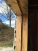 Air-sealing tape carefully seals the seams around the window framing.