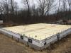 ICF foundation walls wrap the floor slab in R-22 of insulation while the entire space under the slab is covered with 4.3 inches of closed-cell spray foam.