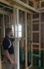 Installing ladder blocking at interior-exterior wall intersections rather than three solid studs in the exterior wall as the supporting surface allows room for insulation in the exterior wall.