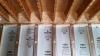 The rim band connecting the insulated precast concrete basement walls to the floor joists above is spray foamed to provide air-sealing and insulation in this hard-to-seal juncture.