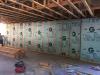 Right - The poured concrete basement walls are insulated along the inside with 2.5 inches of extruded polystyrene insulation.