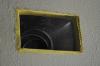 Fiberglass mesh tape is installed around a duct boot in preparation for air sealing with mastic